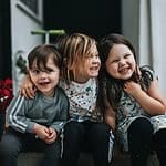 Happy children with friends having fun outdoors. High-resolution image of happy kids smiling, hugging, and enjoying outdoor activities, perfect for family or children's event content.