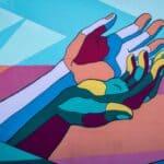 Colorful hand painting, creative art, vibrant mural artwork, street art, urban wall decor. An African American woman distressed and talking to her therapist about her mental health concerns during therapy session.